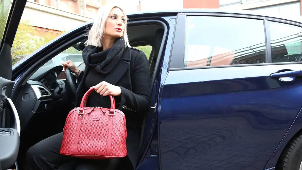 Women's bag collection image with woman getting out of car with gucci bag