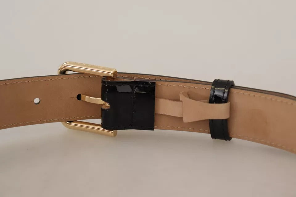 Cinturón de cuero negro con hebilla grabada con el logotipo de metal dorado de Dolce &amp; Gabbana