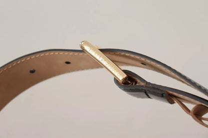 Cinturón de cuero negro con hebilla grabada con el logotipo de metal dorado de Dolce &amp; Gabbana