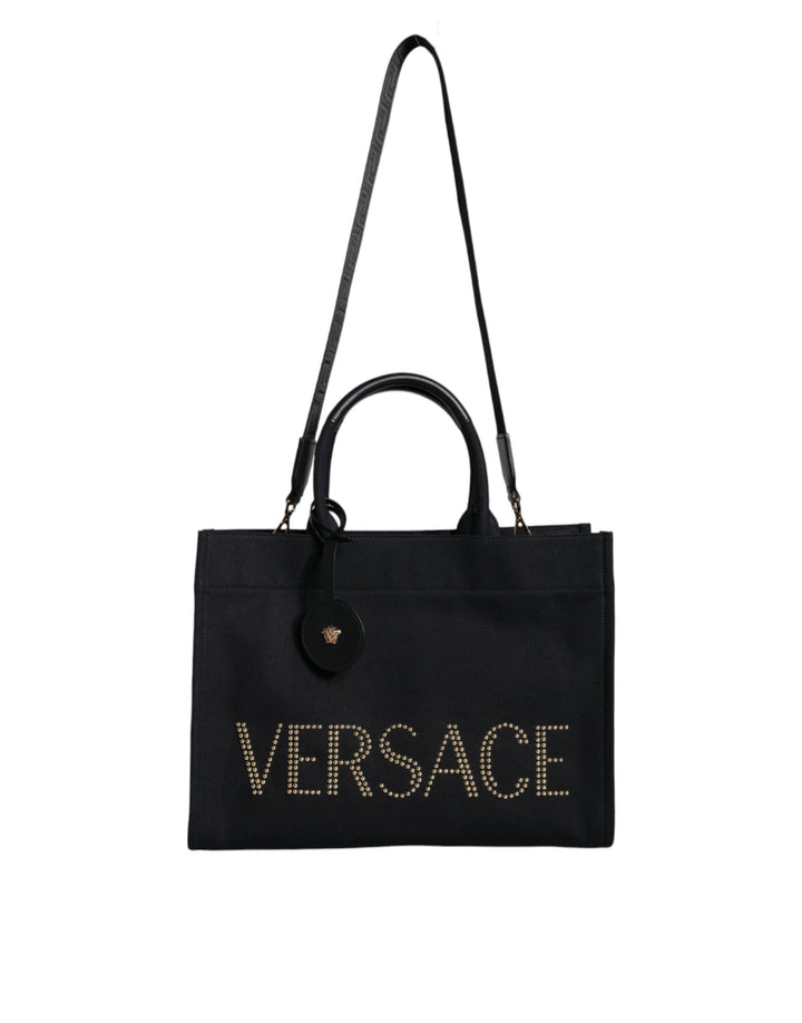 Bolso tote cruzado Versace de lona y cuero con asa superior en color negro y logotipo