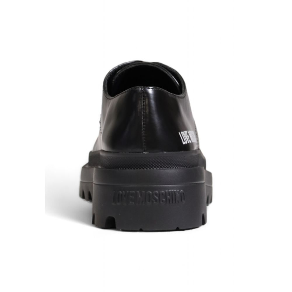 Chaussures plates en polyéthylène noir Love Moschino