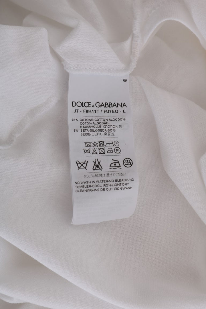 Dolce &amp; Gabbana Élégant chemisier cache-cœur blanc avec accents de cristaux