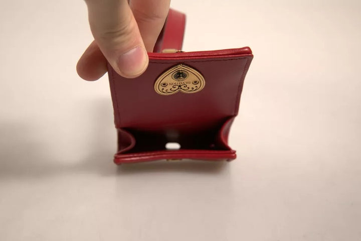 Étui pour Airpods Dolce &amp;amp; Gabbana en cuir noir avec sangle en forme de cœur